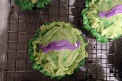 Man eating plant cupcakes with chocolate covered strawberries